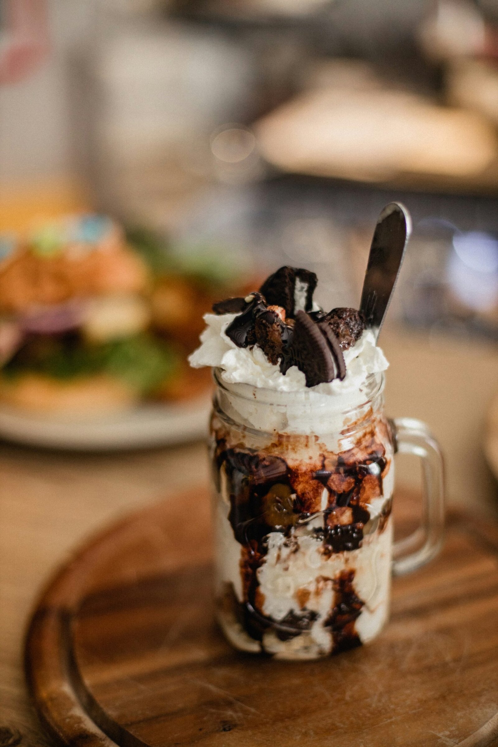 a dessert in a jar with a spoon in it